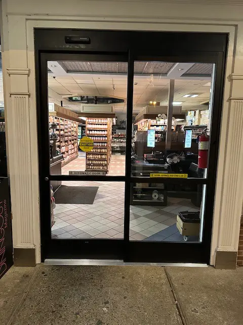 A store front with a large glass door.